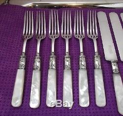 Landers Frary & Clark Mother of Pearl Handle 12 Pc Flatware Set withSterling Bands
